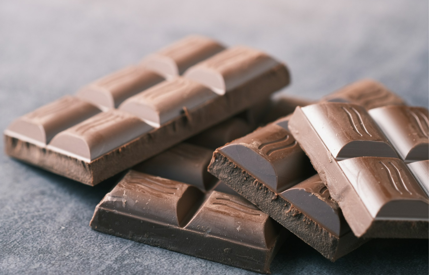 Chocolate bars on grey background