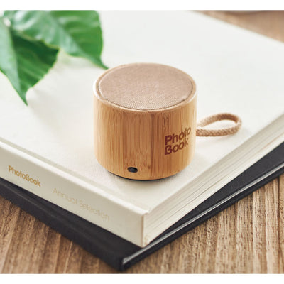 Round bamboo wireless speaker with loop