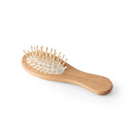 DERN. Wooden hairbrush with round bamboo bristles