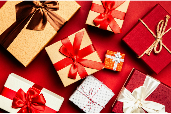 An assortment of well-wrapped Christmas gifts with ribbons