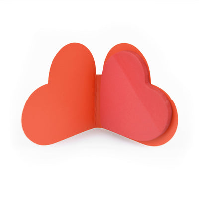 Red Heart shaped post it notes in booklet