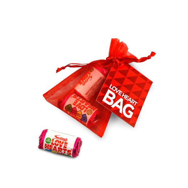 Red Organza Bag with tag containing Love Heart Sweets