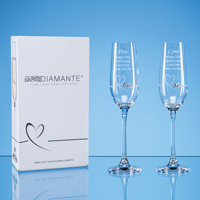Pair of Champagne Flutes with heart shaped cut featuring Swarovski crystals bonded to the glass. With engraved message to loved ones. Accompanies with a beautiful gift box
