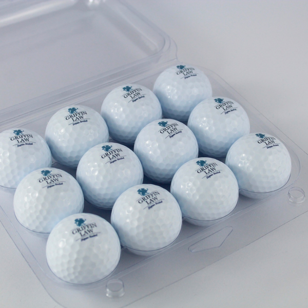 set of 12 Distance Logo Golf Balls inside the clear case